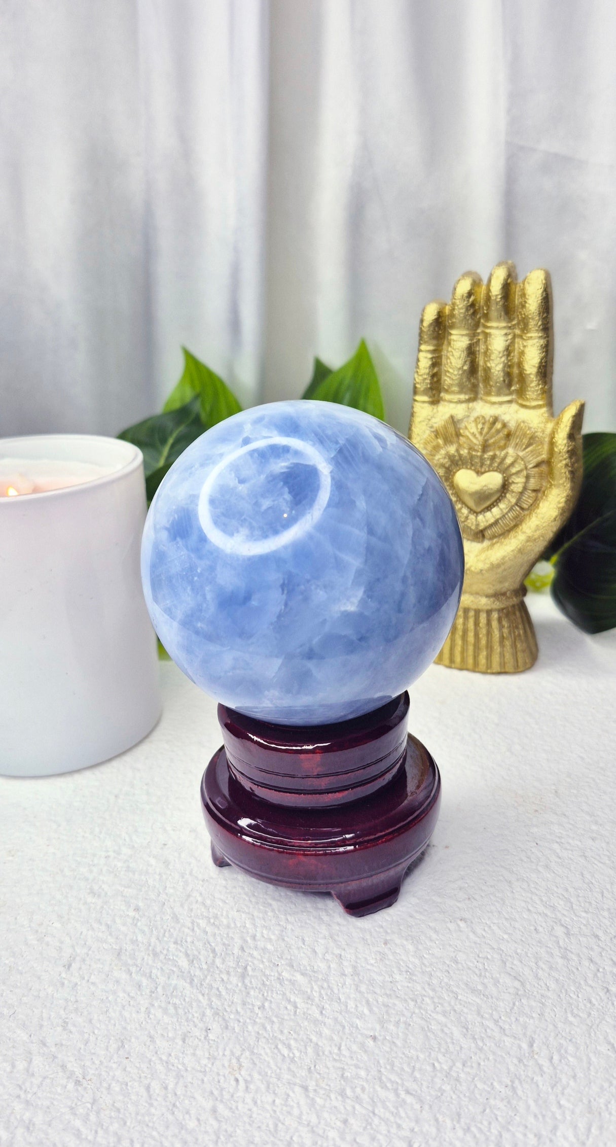 Blue Calcite Sphere on Wooden Stand