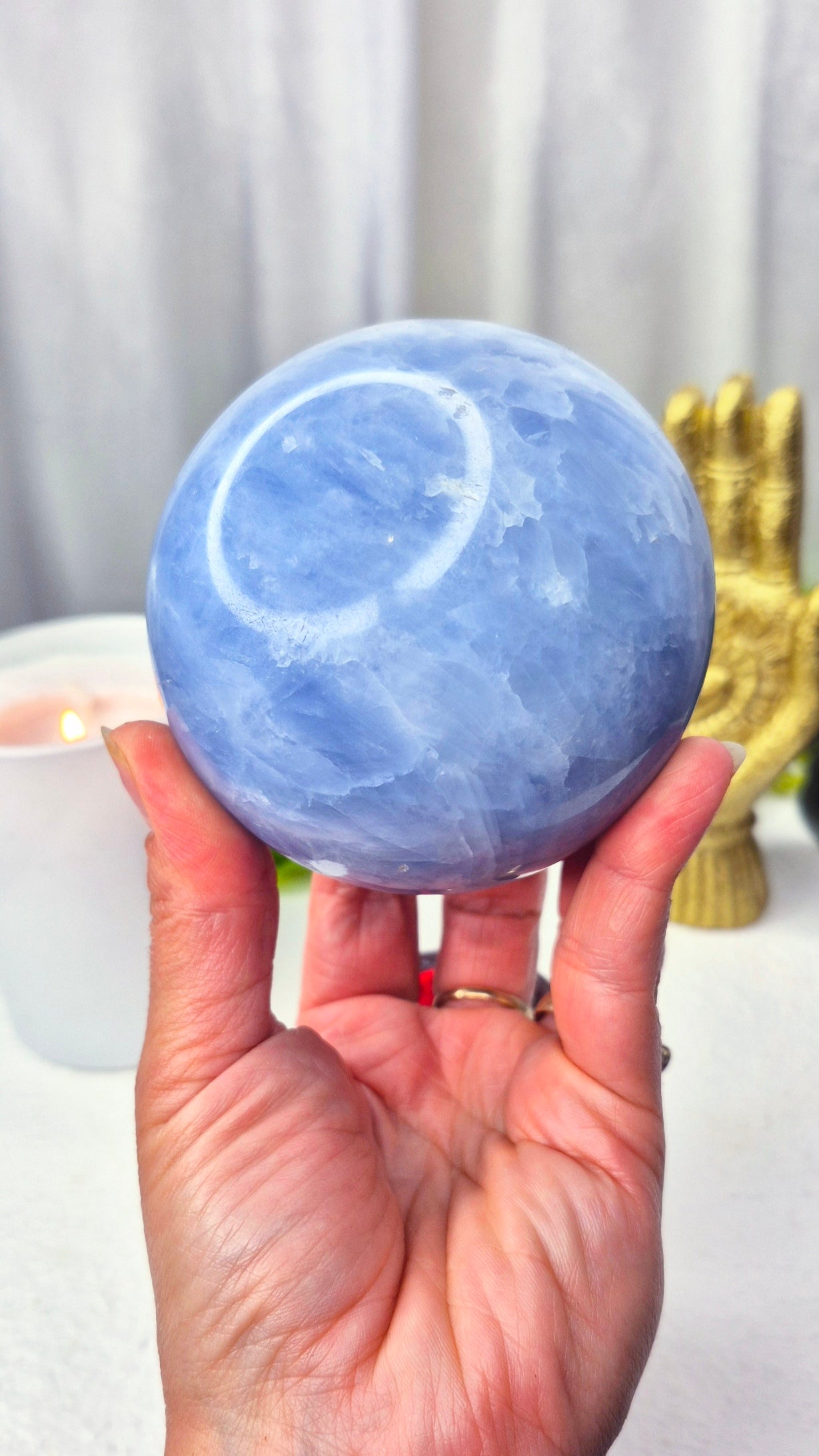 Blue Calcite Sphere on Wooden Stand