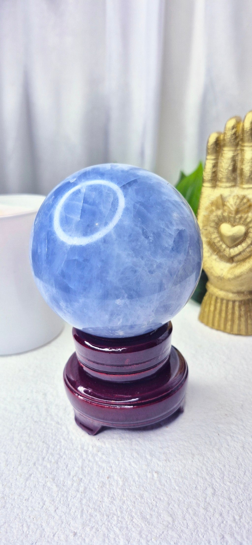 Blue Calcite Sphere on Wooden Stand