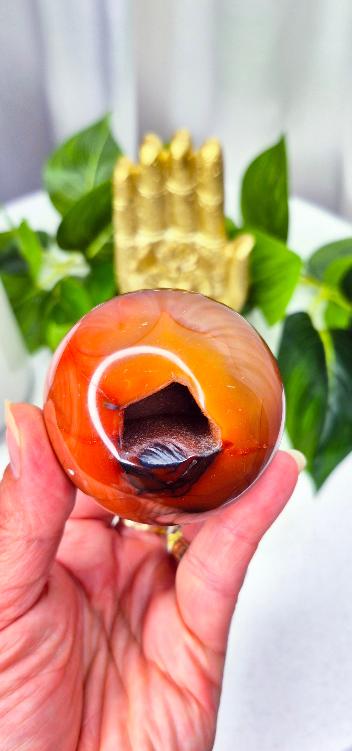 Carnelian Sphere with Druzy Cave on stand