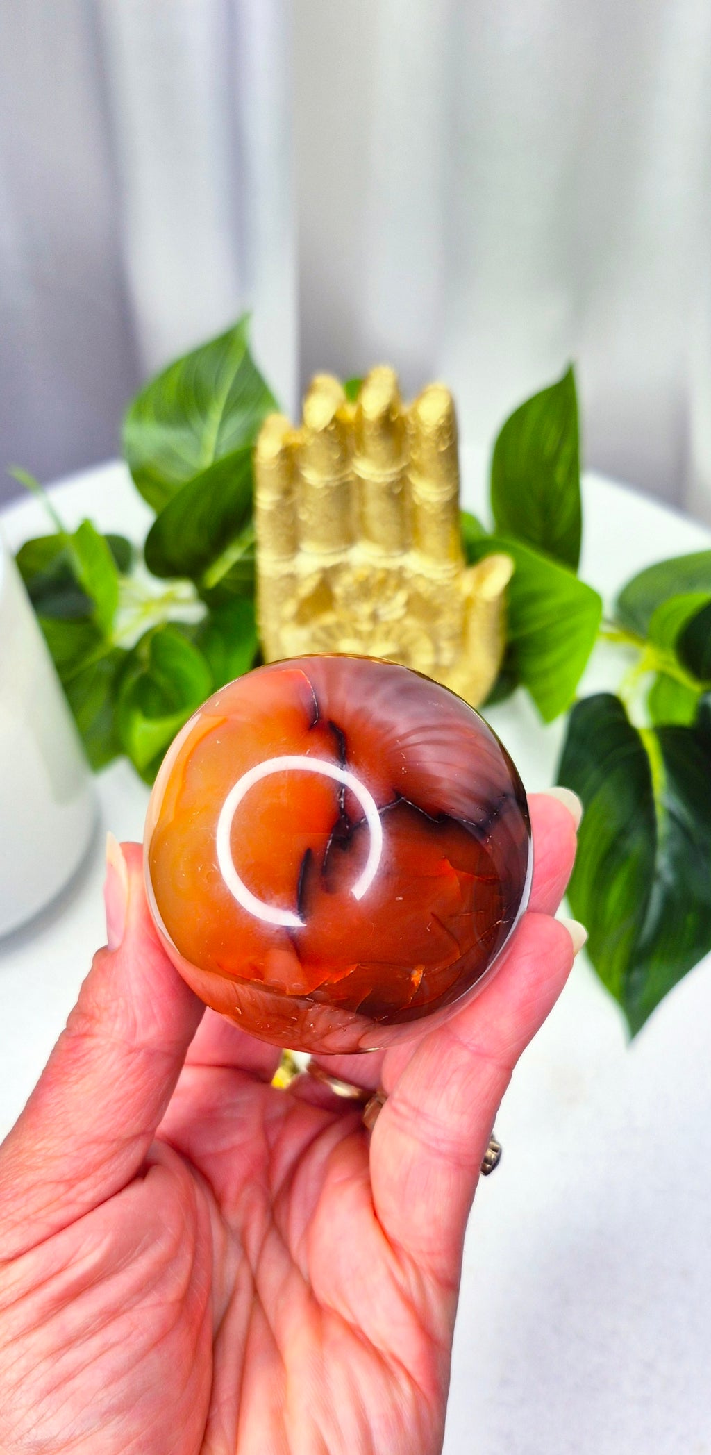 Carnelian Sphere with Druzy Cave on stand