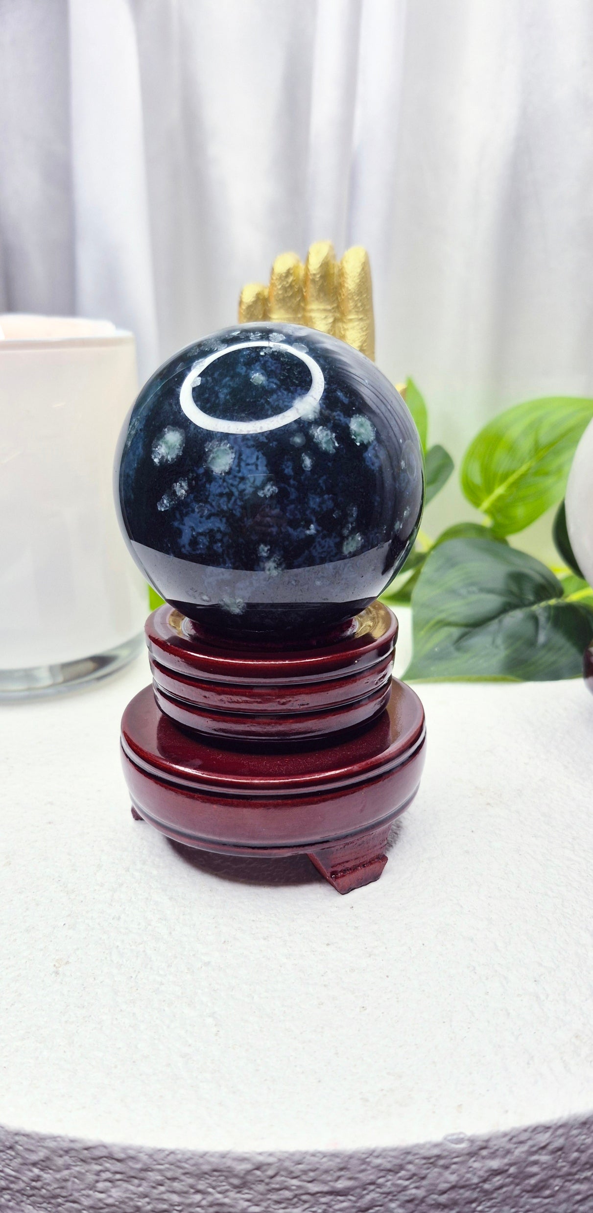 Moss Agate Sphere on Wooden Stand