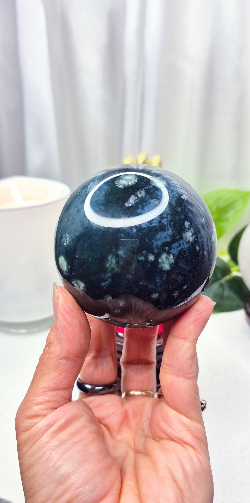Moss Agate Sphere on Wooden Stand