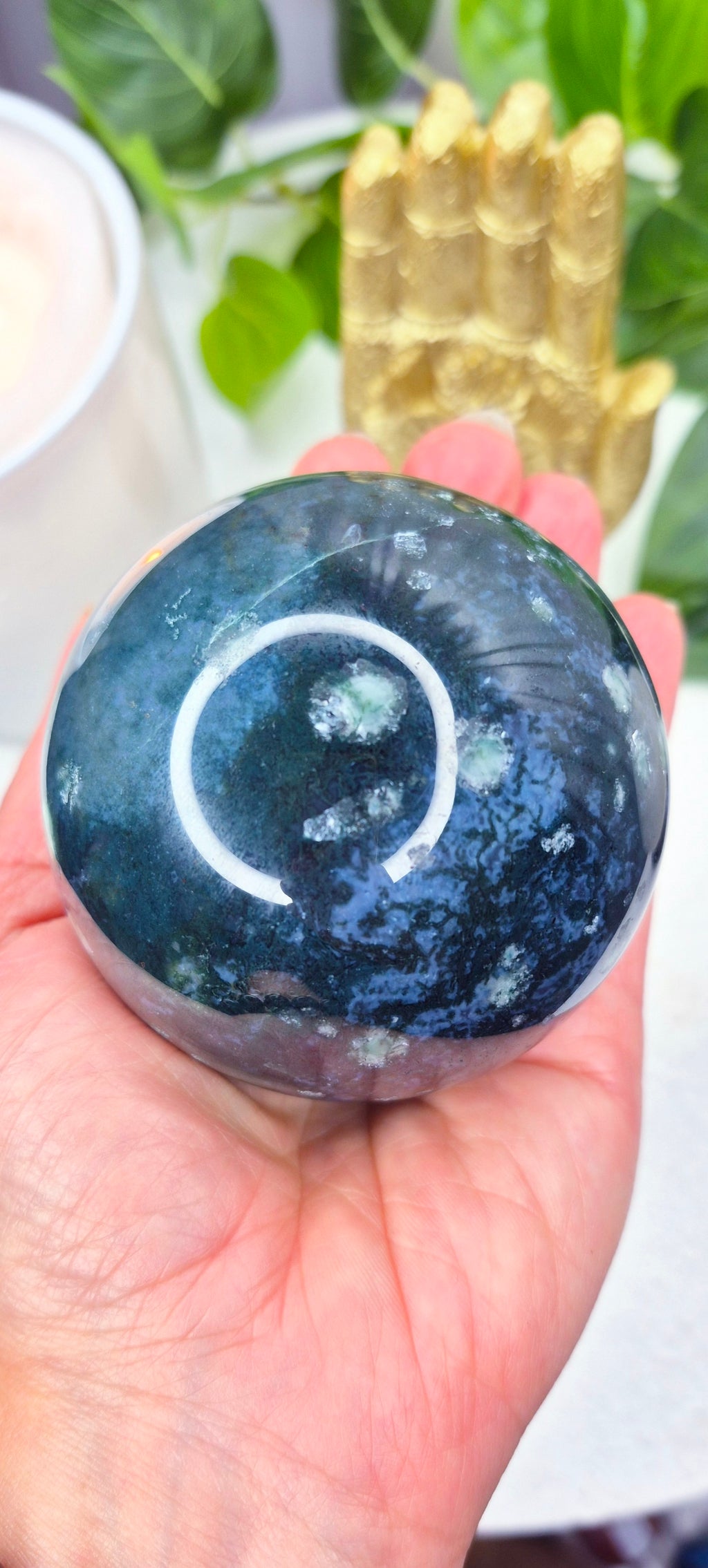 Moss Agate Sphere on Wooden Stand