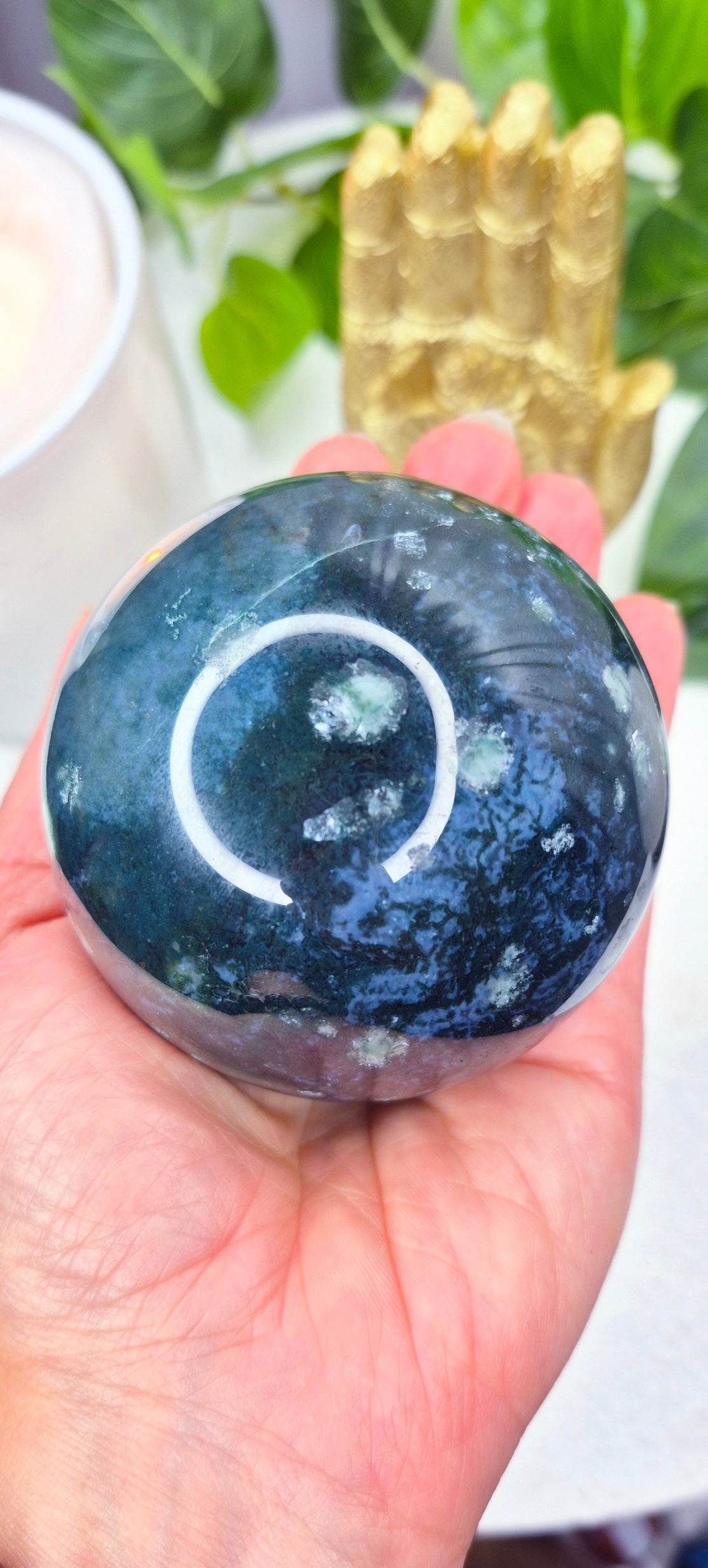 Moss Agate Sphere on Wooden Stand