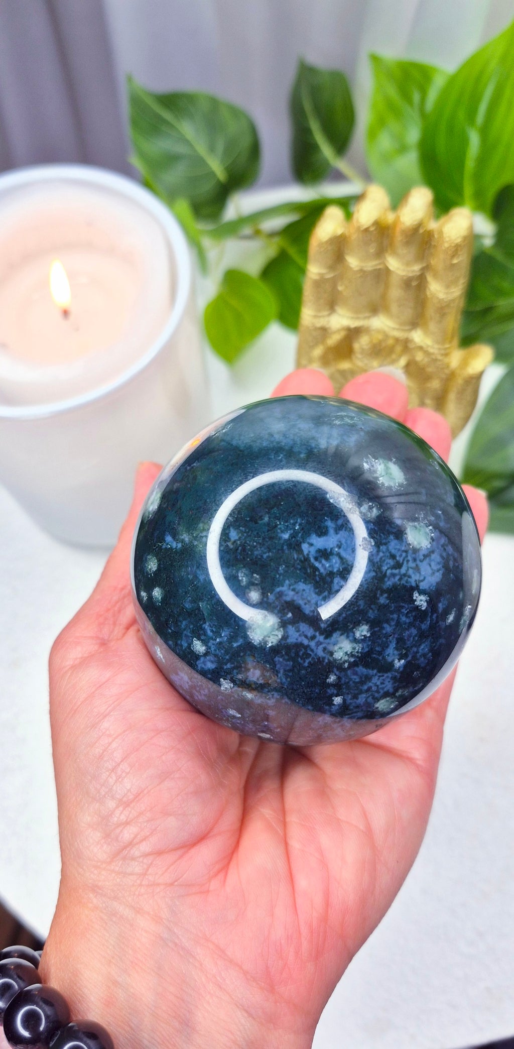 Moss Agate Sphere on Wooden Stand