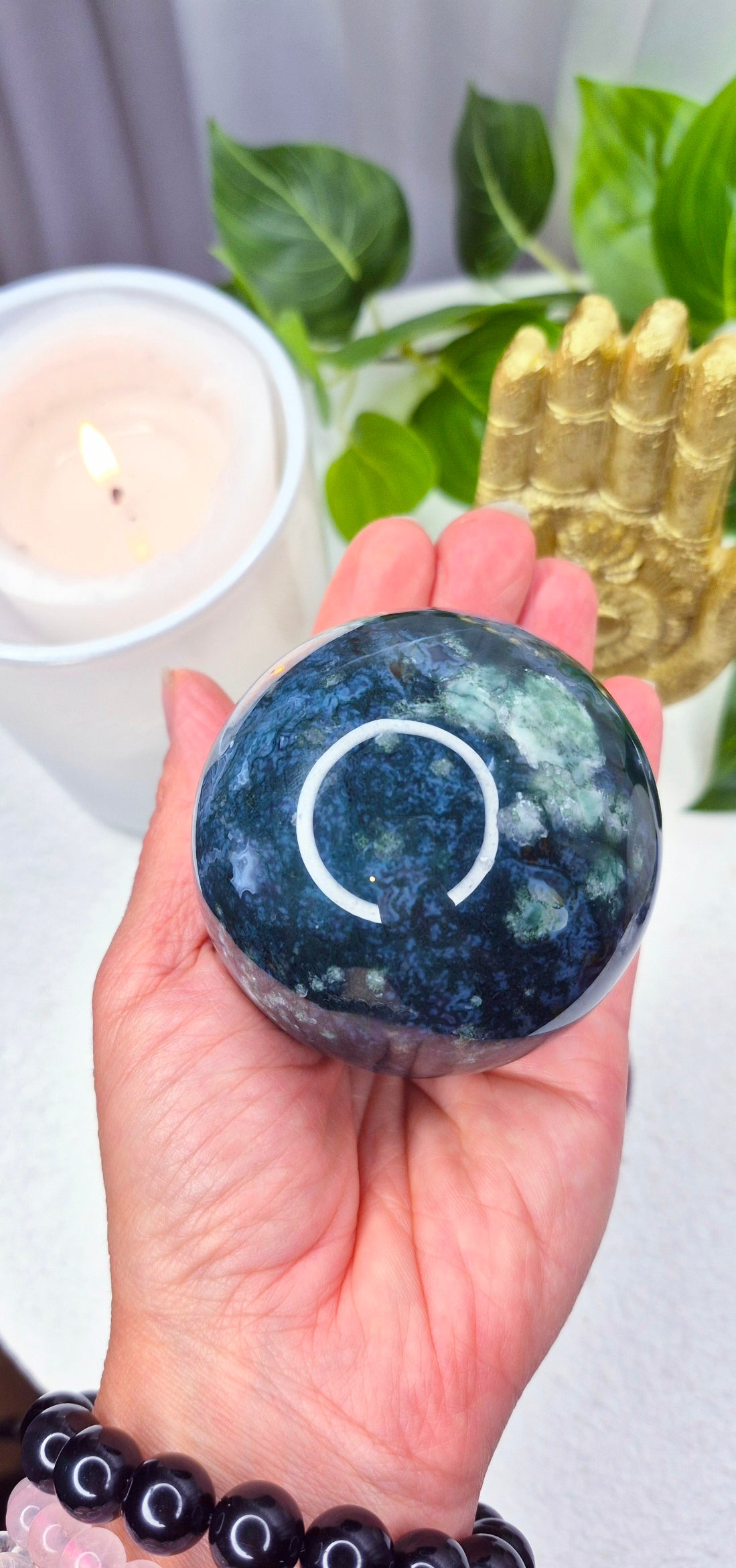 Moss Agate Sphere on wooden Stand