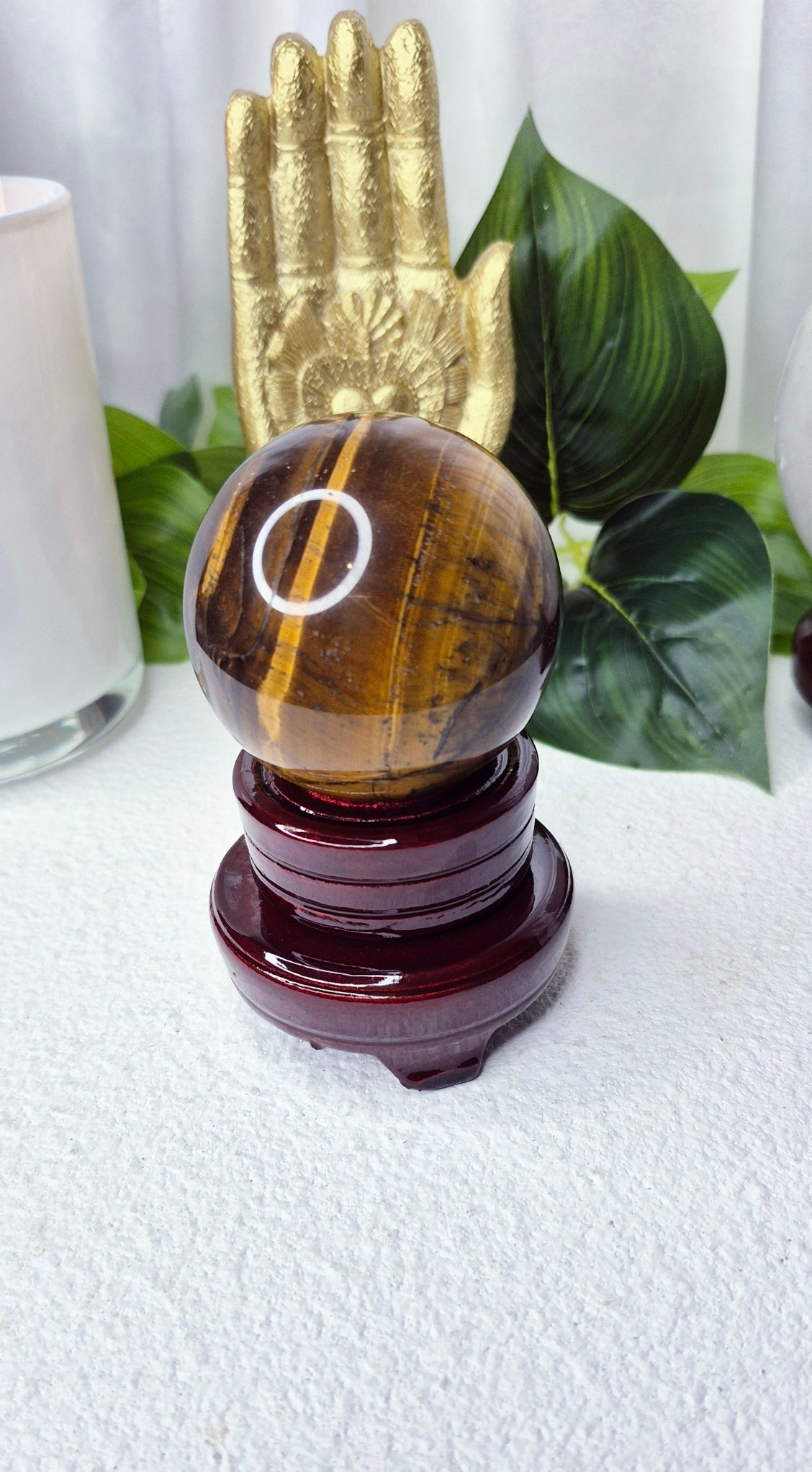 Tigers Eye Sphere on wooden Stand