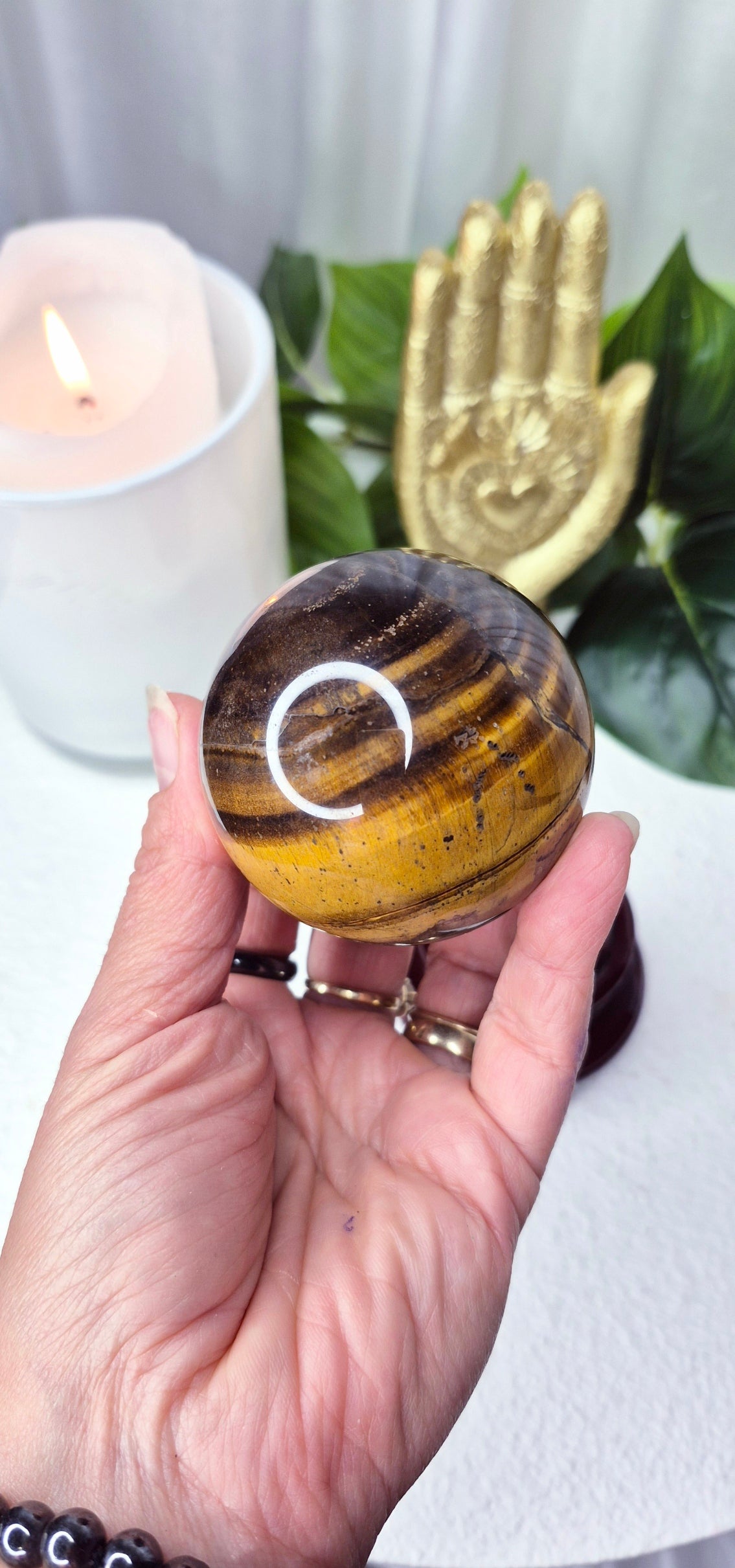 Tigers Eye Sphere on wooden Stand
