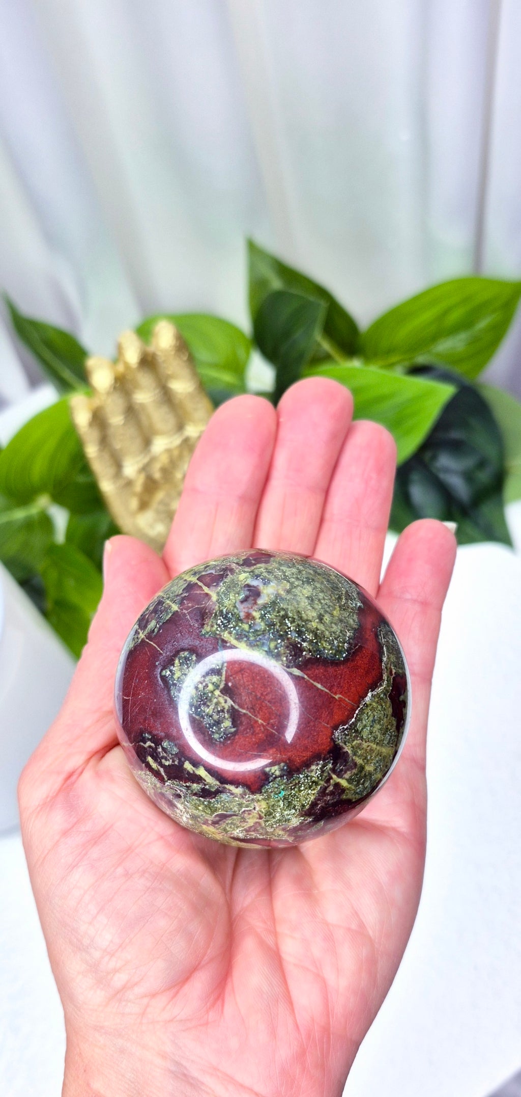 Dragon Bloodstone Sphere on stand